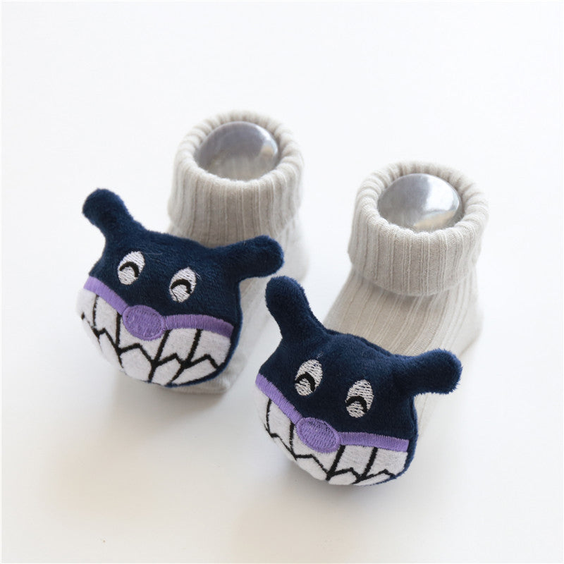 Tiny Steps Socks featuring adorable monster face design in soft cotton for babies.