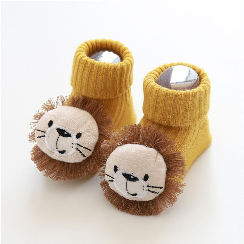 Tiny Steps Socks in yellow with lion faces for babies, made of soft cotton and designed for comfort.
