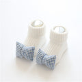 Tiny Steps Socks soft cotton baby socks with blue checkered bows for infants.