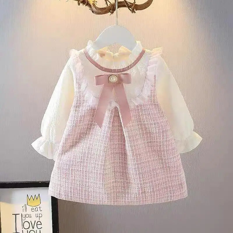 Girls long sleeve dress in pink with ruffles and bow, perfect for casual spring and autumn occasions.