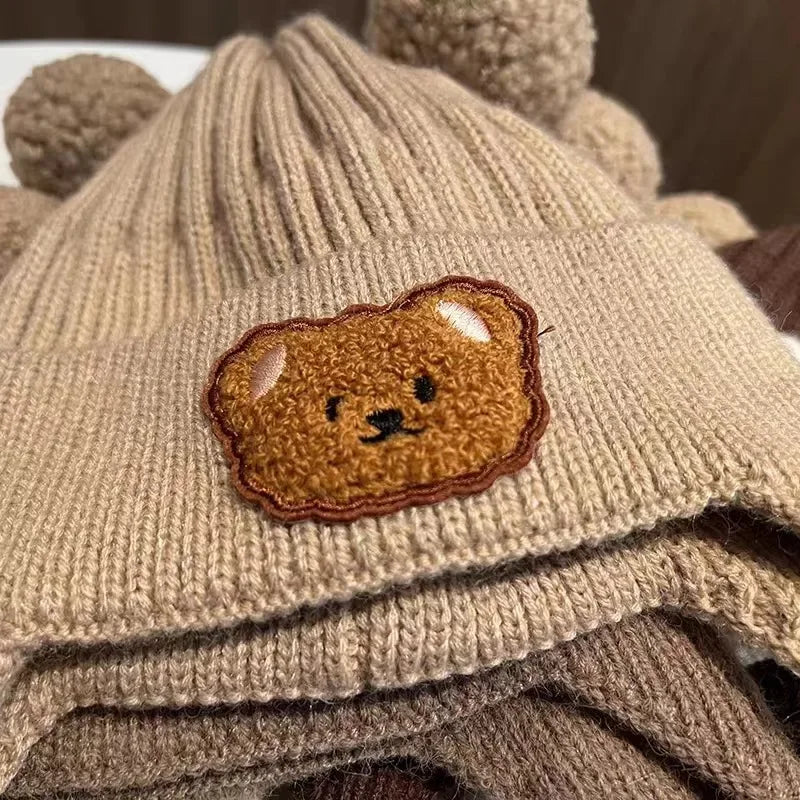 baby winter wool hat with bear ears featuring a cute bear patch and ear details, perfect for winter wear.